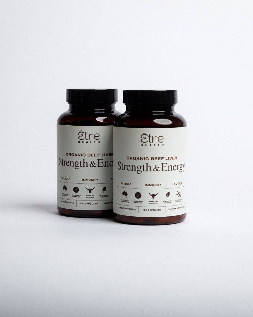 Two bottles of 'Strength & Energy' organic beef liver supplement on a white background