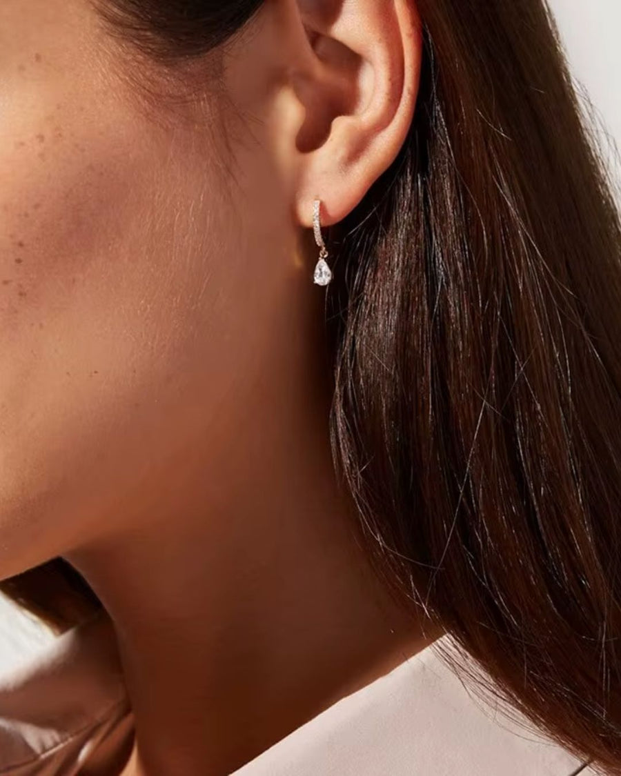 CRYSTAL HUGGIE PEAR-CUT DROP EARRINGS 18K GOLD PVD - STUDIO JO STORE  