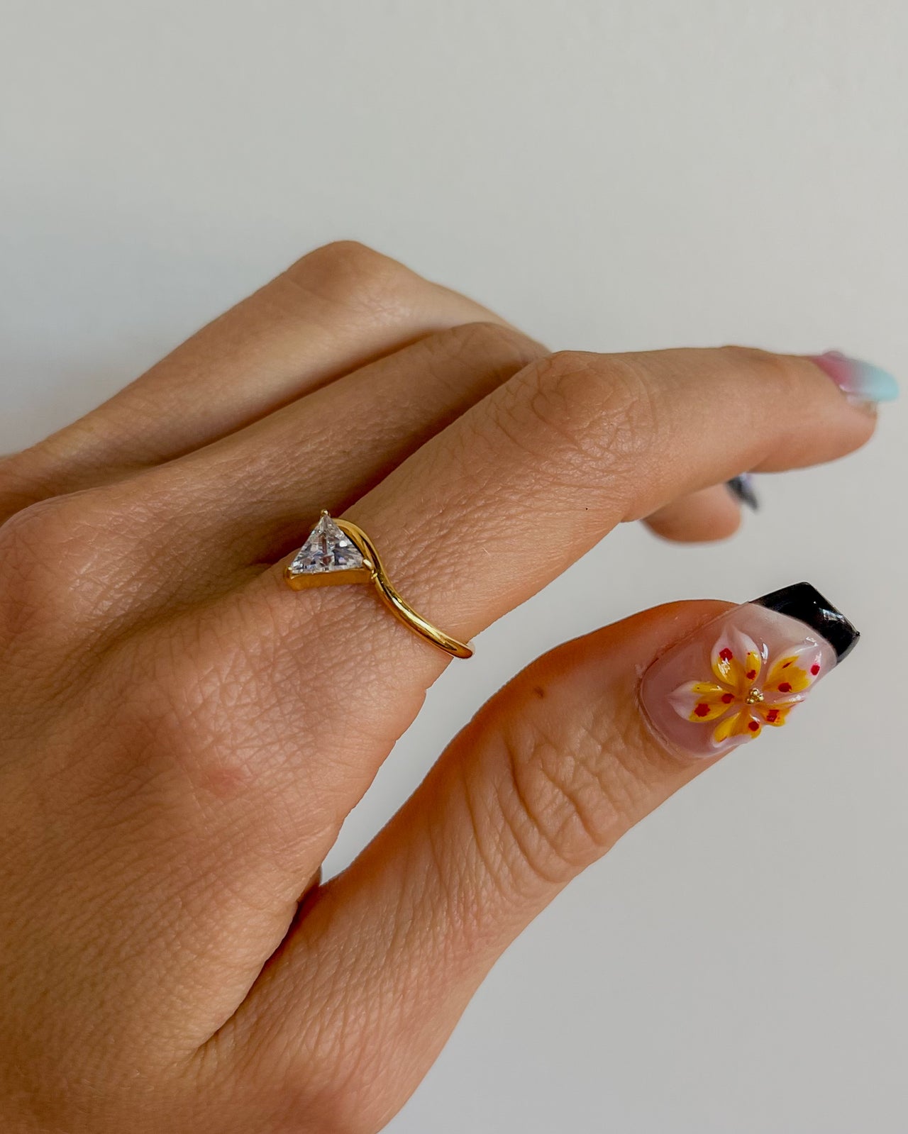 TRIANGLE TRILLION CUT ZIRCONIA RING 18K GOLD PVD - STUDIO JO STORE  