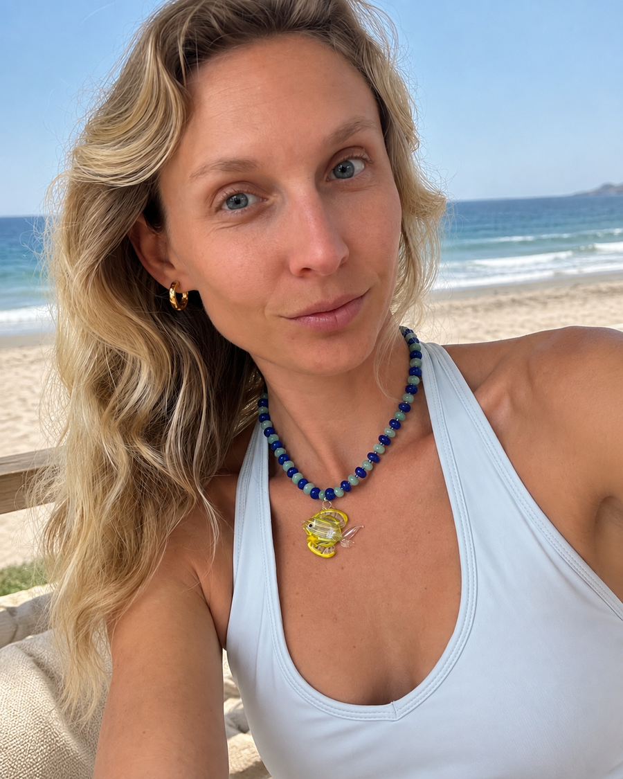 Handmade tropical fish pendant necklace with blue and green glass beads, crafted by TEGAN RAE JEWELLERY.