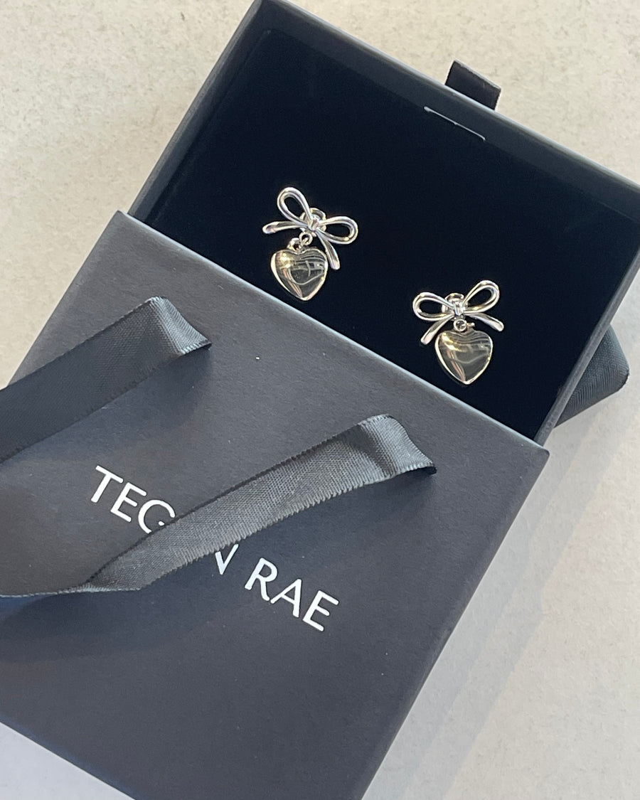 BOW DROP HEART STUD EARRINGS SILVER - STUDIO JO STORE  