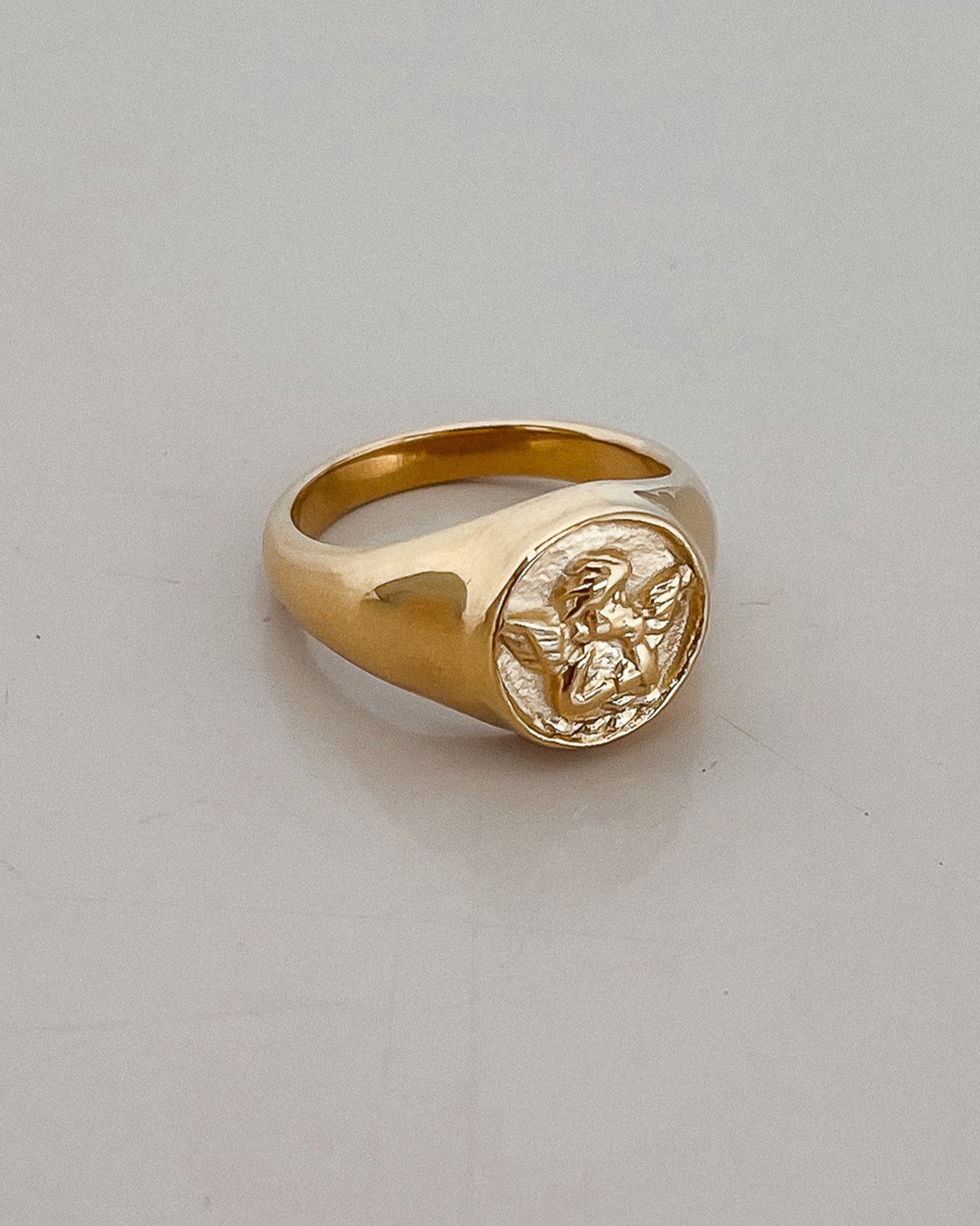 CUPID ANGEL ROUND SIGNET RING 18K GOLD PLATED - STUDIO JO STORE  