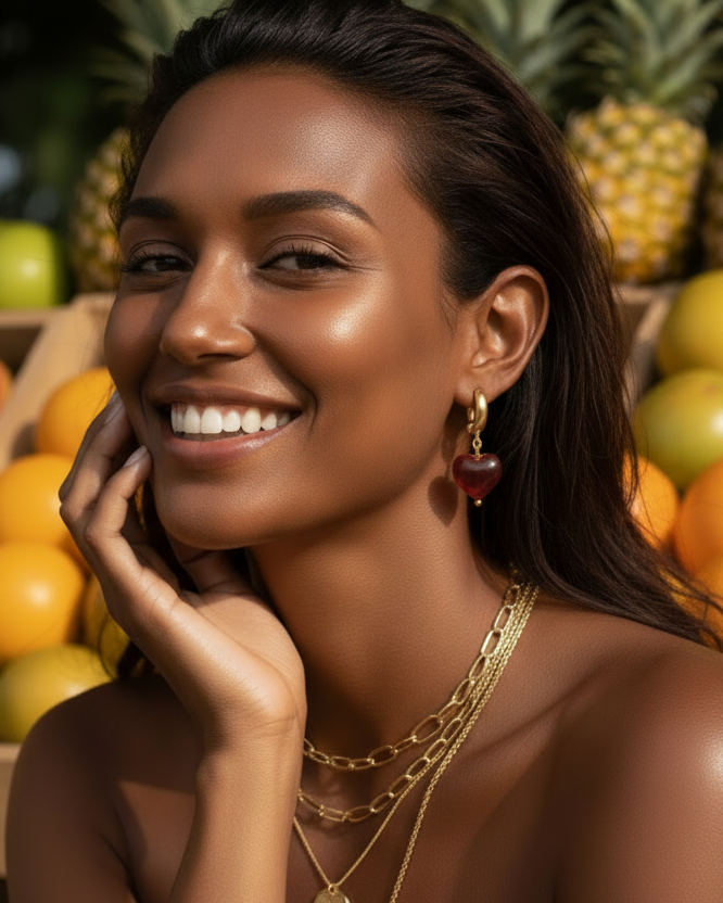 Woman with jewelry in front of a fruit background