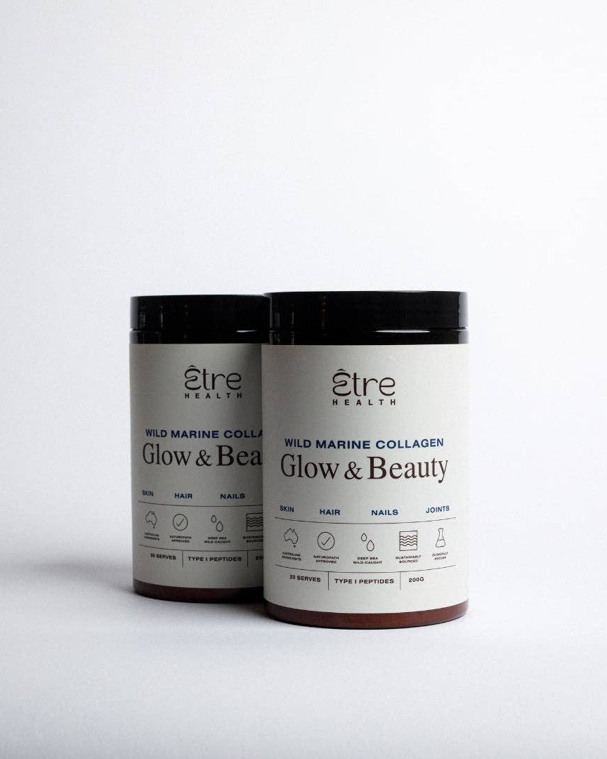 Etre Health Glow & Beauty Wild Marine Collagen supplement bottle with label and capsules in natural light.