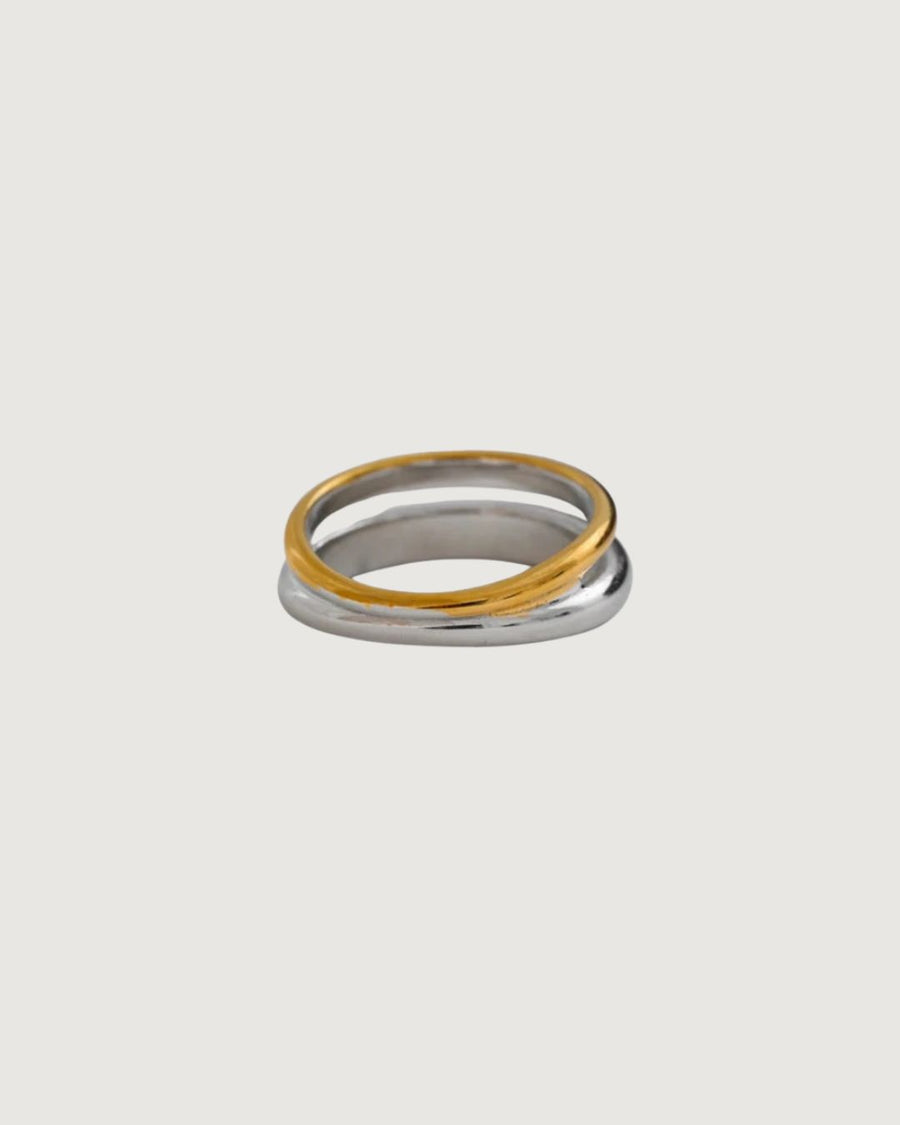 Two-tone gold and silver band ring from STUDIO JO STORE with a sleek, modern design.