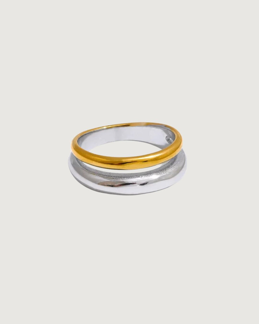 Two-tone gold and silver band Unity ring by STUDIO JO STORE, showcasing a sleek, modern design with mixed metal finish.