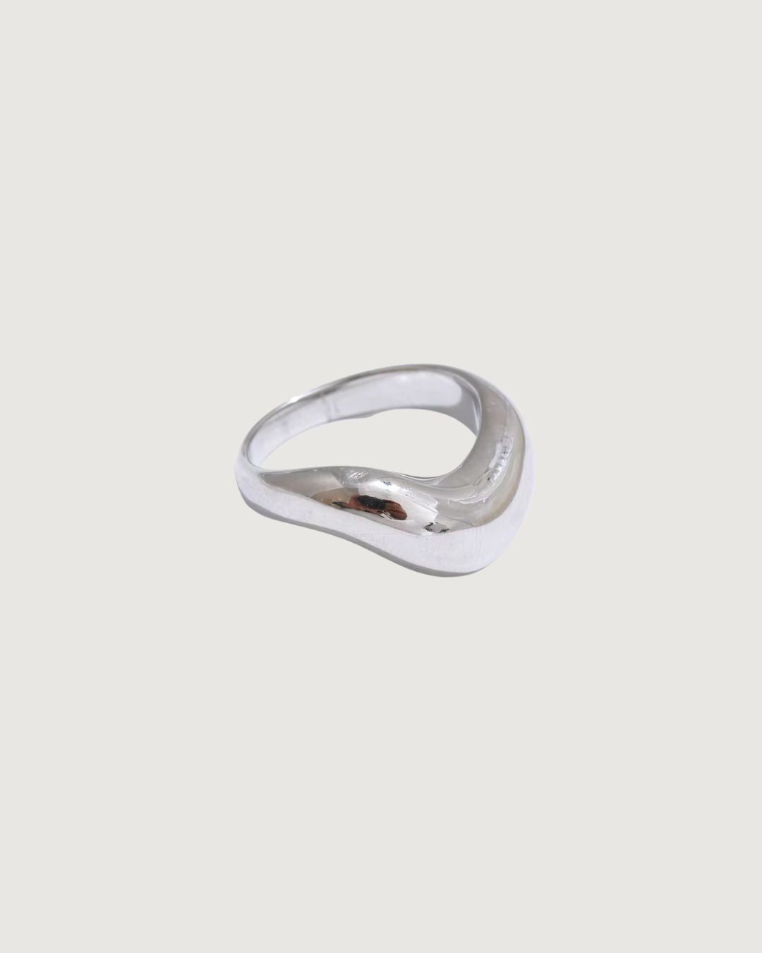 Silver Luna Curve Band Statement Ring by TEGAN RAE JEWELLERY, featuring a bold, curved design on a sleek silver band.