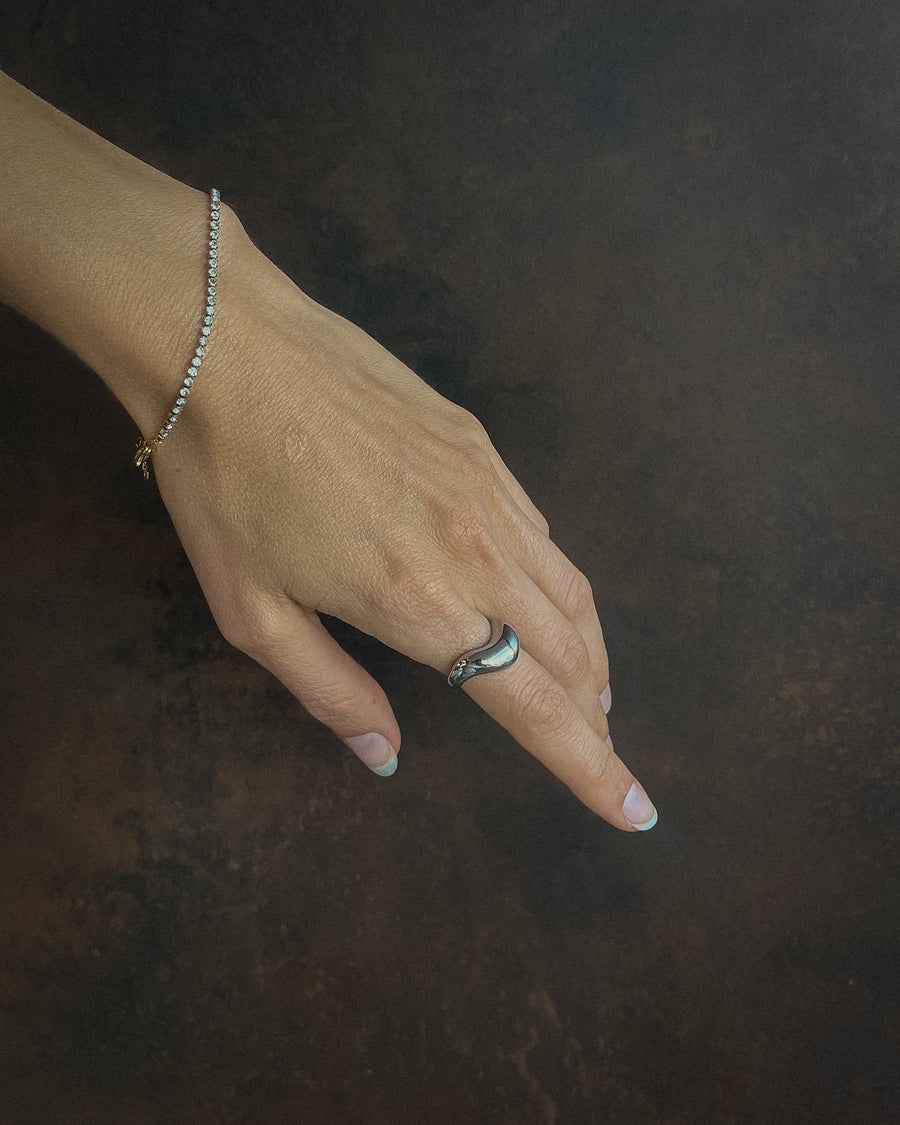 Silver Luna Curve Band Statement Ring by TEGAN RAE JEWELLERY featuring a bold, curved design and sleek silver finish.