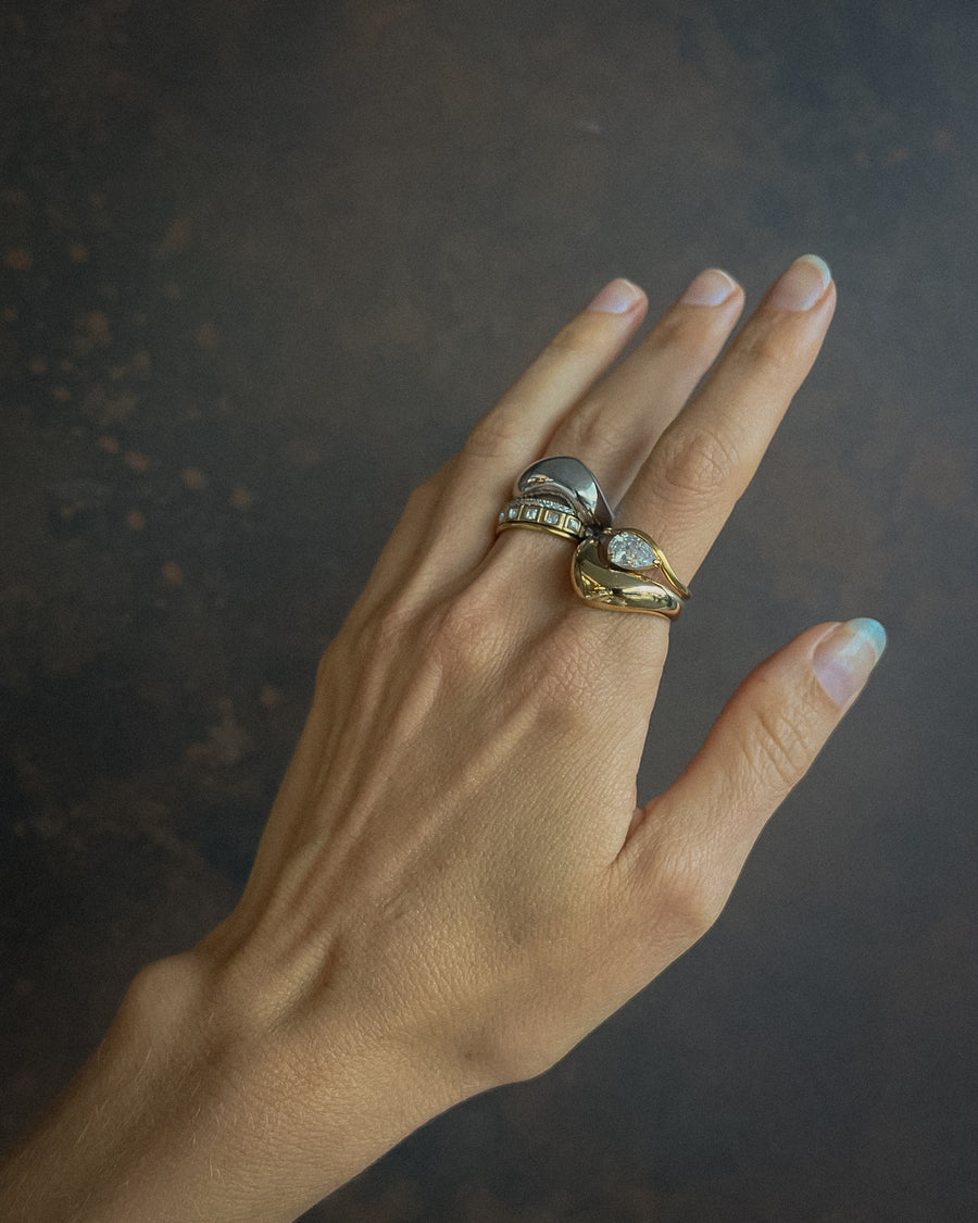 Silver Luna Curve Band Statement Ring by TEGAN RAE JEWELLERY, featuring a bold, curved design with intricate detailing.
