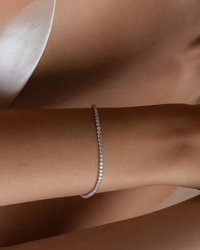 Thumbnail for Silver tennis bracelet on a person's wrist with a neutral background
