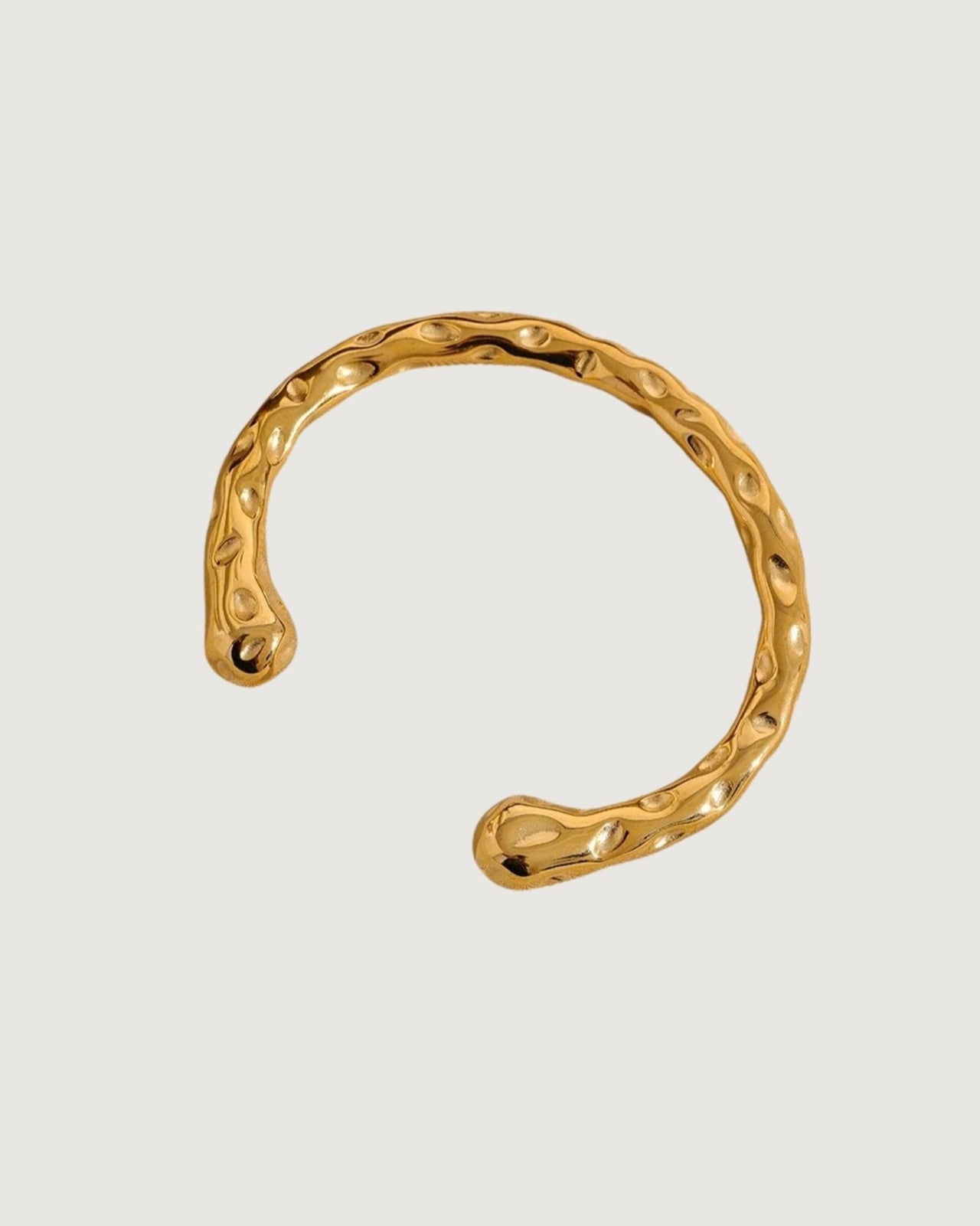 Gold textured cuff bracelet by Tegan Rae Jewelry featuring a sleek, modern design with a bold, metallic finish.