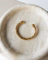 Thumbnail for Gold textured cuff bracelet by TEGAN RAE JEWELLERY with a stylish, bold design and intricate surface details.