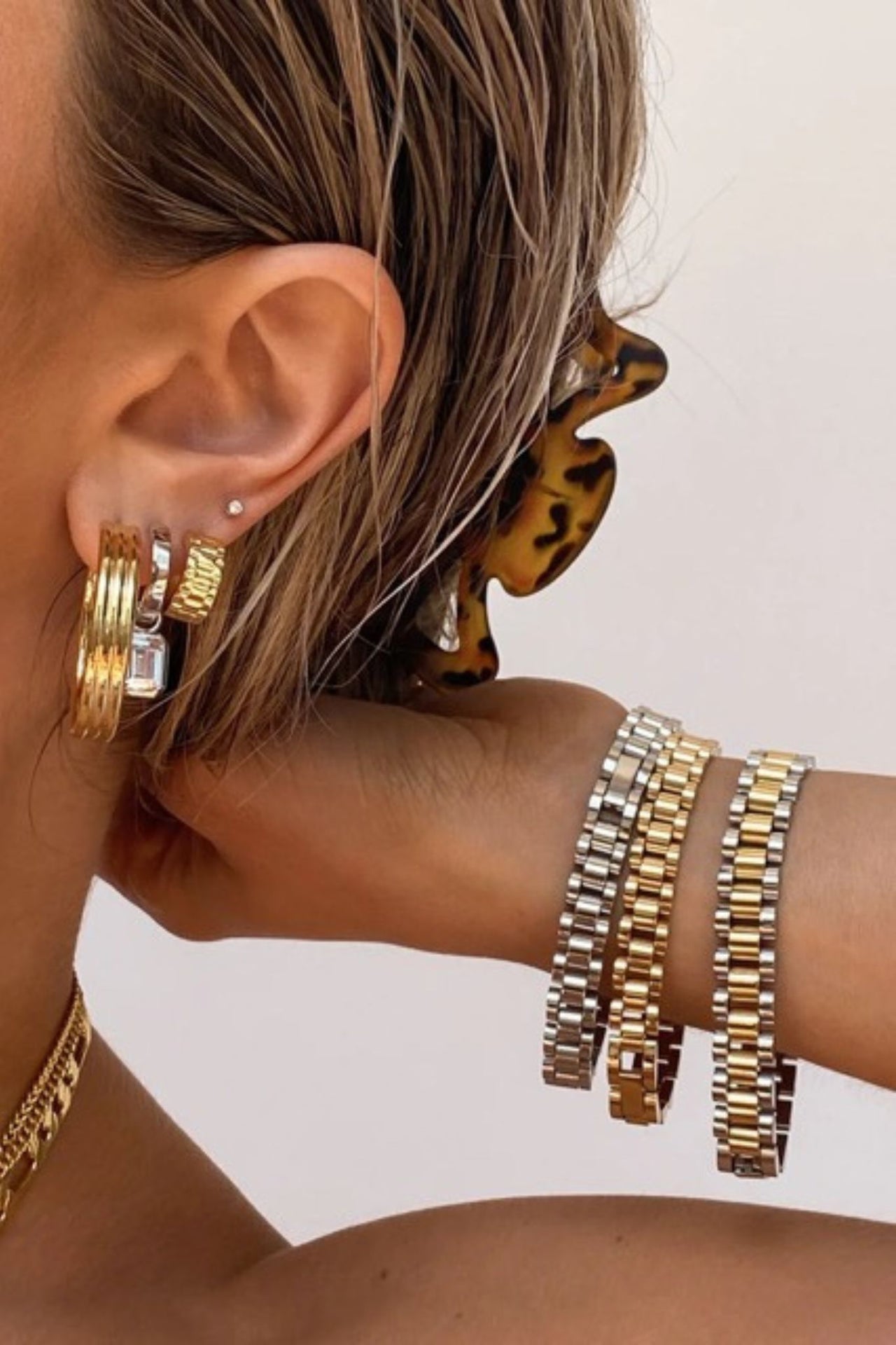 Gold watch link chain bracelet by TEGAN RAE JEWELLERY featuring a sleek, elegant design with interconnected watch-inspired links.