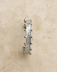 Thumbnail for Silver Zeah textured cuff bracelet by TEGAN RAE JEWELLERY, showcasing a sleek, modern design with intricate textured detailing.