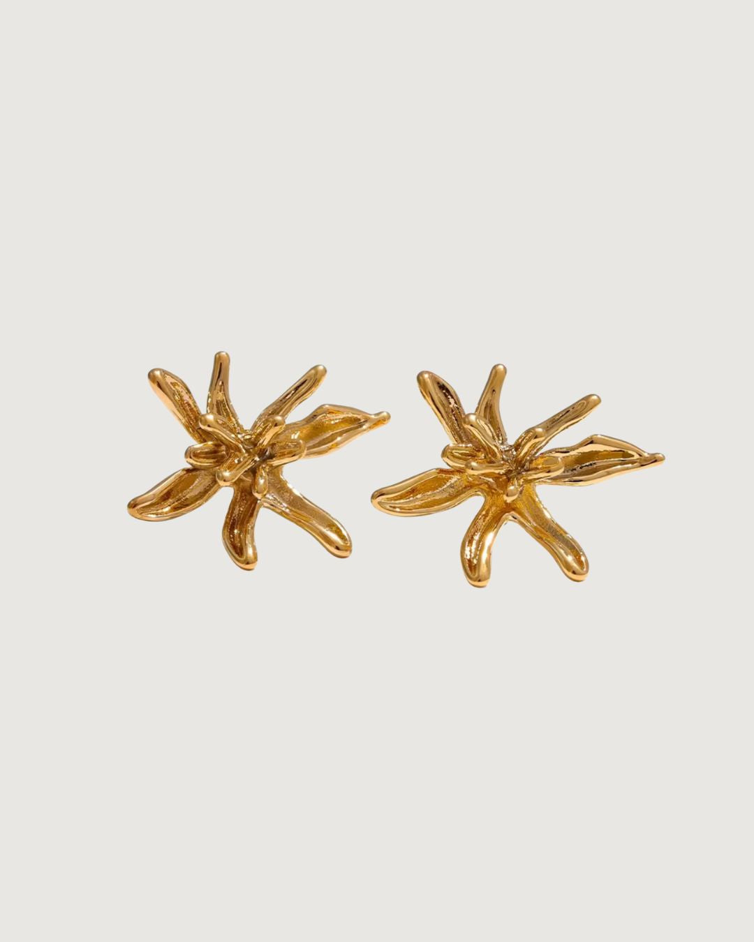 Flower Burst earrings by TEGAN RAE JEWELLERY in 18k gold, featuring intricate flower-shaped design and elegant craftsmanship.
