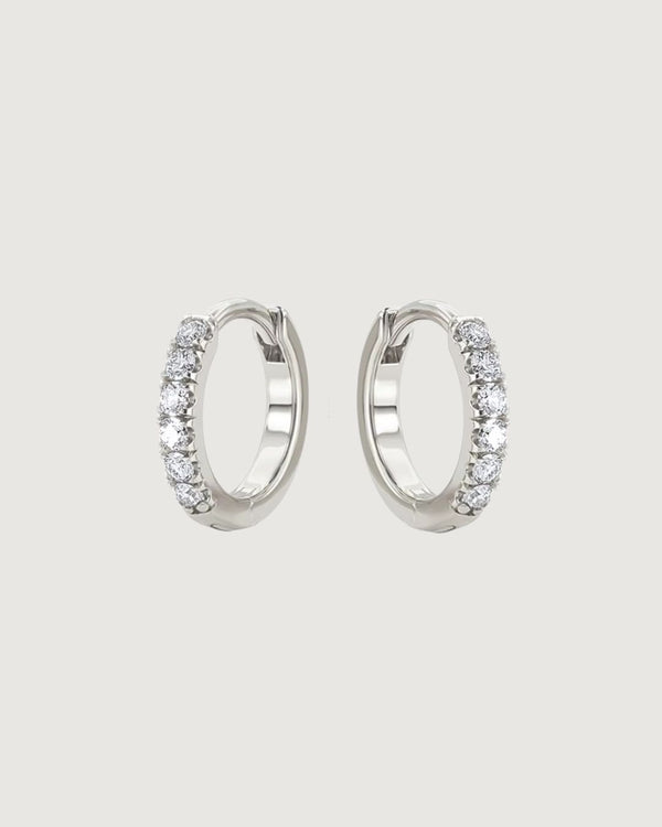 Tegan Rae Jewellery Crystal Huggie Hoop Earrings, 10mm platinum silver, showcasing sparkling crystal accents and sleek hoop design.