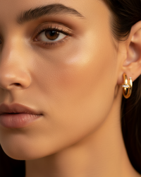 Thumbnail for Close-up of a woman's face with a gold earring