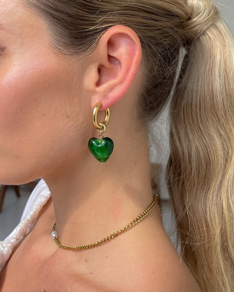 Green emerald dream heart drop earrings by Tegan Rae Jewellery, featuring elegant teardrop-shaped design with sparkling gemstones.