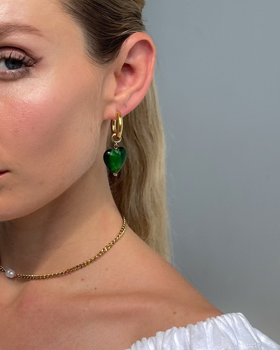 Green emerald dream heart drop earrings by Tegan Rae Jewellery featuring elegant teardrop design with sparkling gemstone accents.
