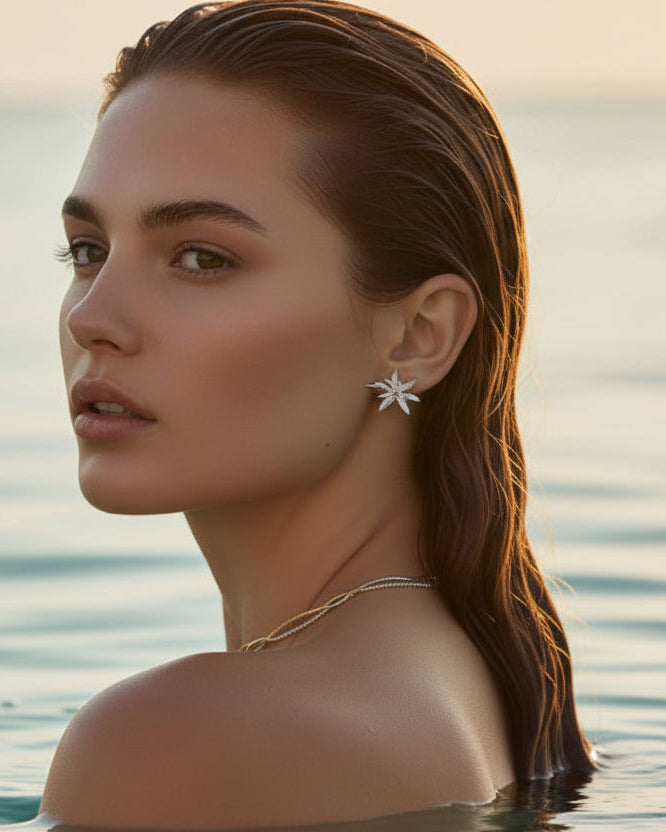 Flower Burst earrings in platinum silver by Tegan Rae Jewelry, featuring intricate floral design and elegant craftsmanship.