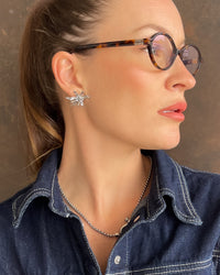 Thumbnail for Flower Burst earrings by Tegan Rae Jewellery in platinum silver, featuring intricate floral design and sparkling accents.