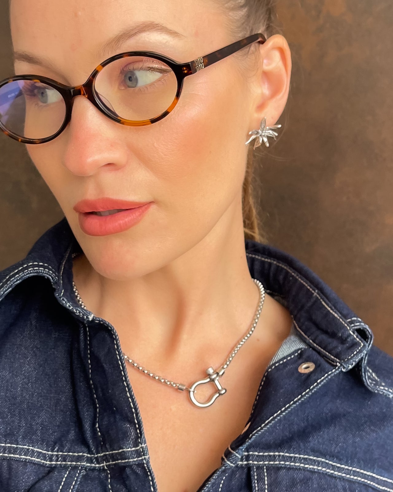Flower Burst earrings by Tegan Rae Jewellery in platinum silver, showcasing intricate floral design and elegant craftsmanship.