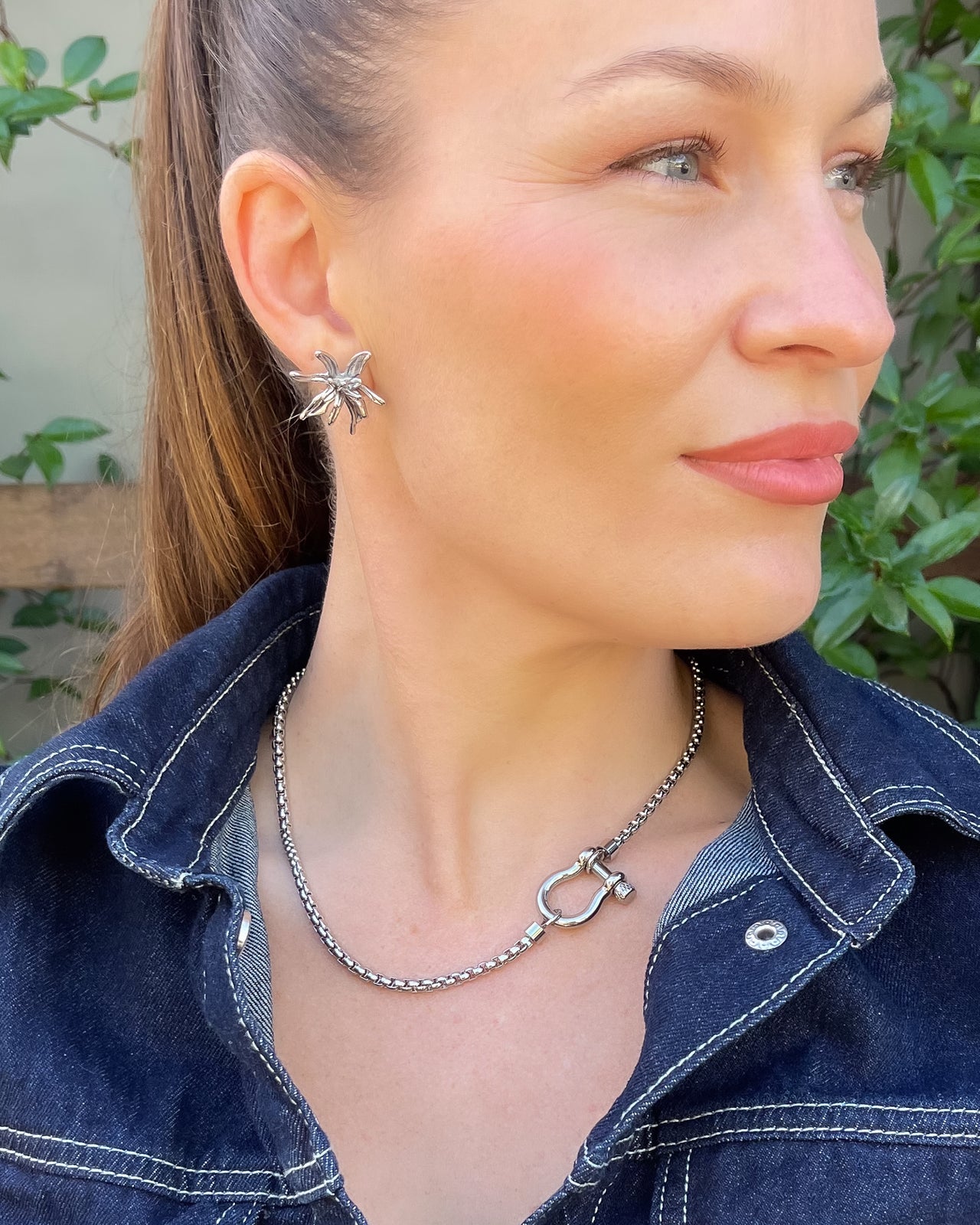 Flower Burst earrings by Tegan Rae Jewellery in platinum silver, featuring intricate floral design and sparkling gemstone accents.