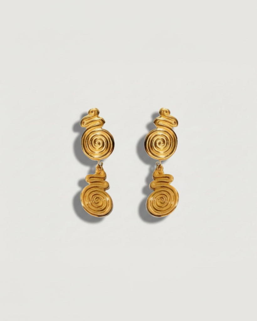 Gold spiral drop stud earrings by Tegan Rae Jewellery featuring elegant, swirling design in shiny gold finish.