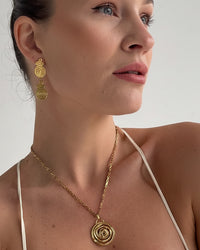 Thumbnail for Gold spiral drop stud earrings by Tegan Rae Jewellery featuring elegant, curved design in shiny gold metal.
