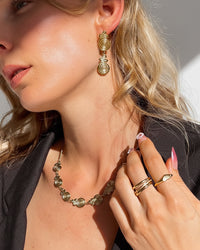 Thumbnail for Golden spiral drop stud earrings by Tegan Rae Jewelry, featuring elegant gold design and contemporary style.