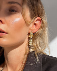 Thumbnail for Gold spiral drop stud earrings by Tegan Rae Jewellery featuring a sleek, modern spiral design in shiny gold finish.