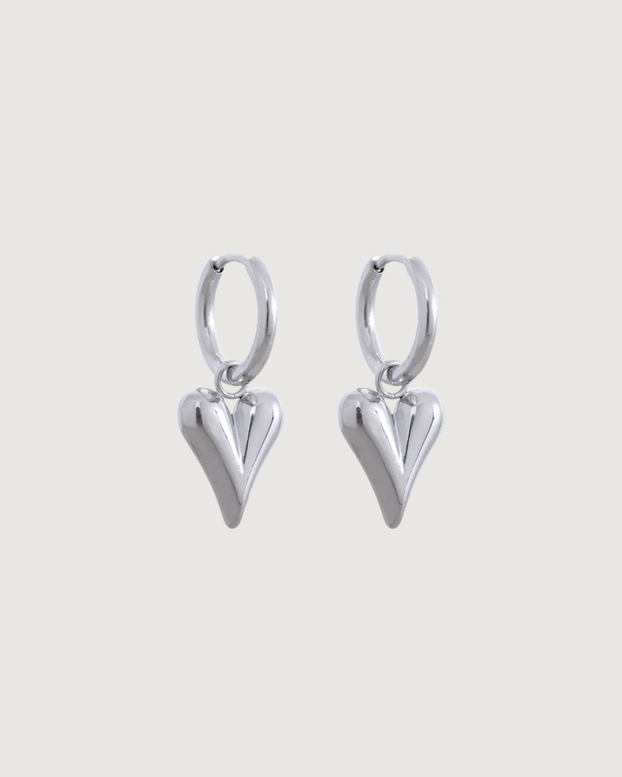 Silver heart charm hoop earrings by Tegan Rae Jewellery featuring elegant hoop design with delicate heart accents.