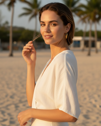 Thumbnail for Woman on a beach with palm trees in the background