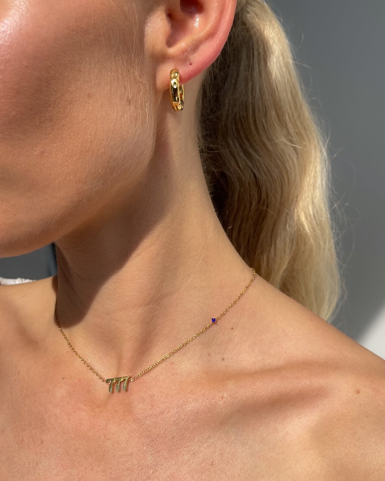 Organic hammered gold statement hoop earrings by Tegan Rae Jewellery, 19mm 18k gold PVD finish, stylish and modern jewelry accessory.