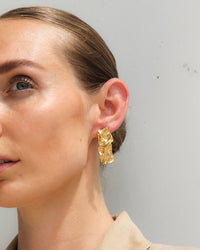 Thumbnail for Gold textured stud earrings by Tegan Rae Jewelry showcasing a stylish, contemporary design with a subtle textured surface.