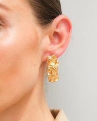 Thumbnail for Gold textured stud earrings from Tegan Rae Jewellery, close-up of the small, round stud earrings with a textured surface.