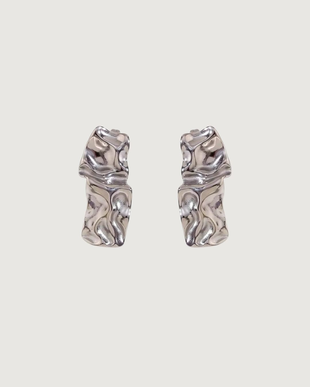 Gold textured stud earrings by TEGAN RAE JEWELLERY, close-up of sleek, minimalist earring design on a white background.