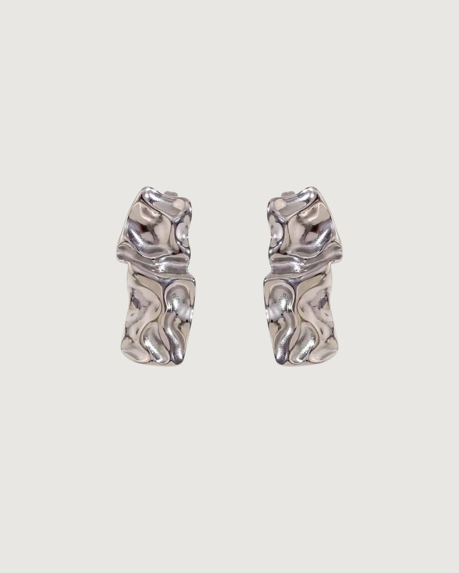 Gold textured stud earrings by TEGAN RAE JEWELLERY, close-up of sleek, minimalist earring design on a white background.