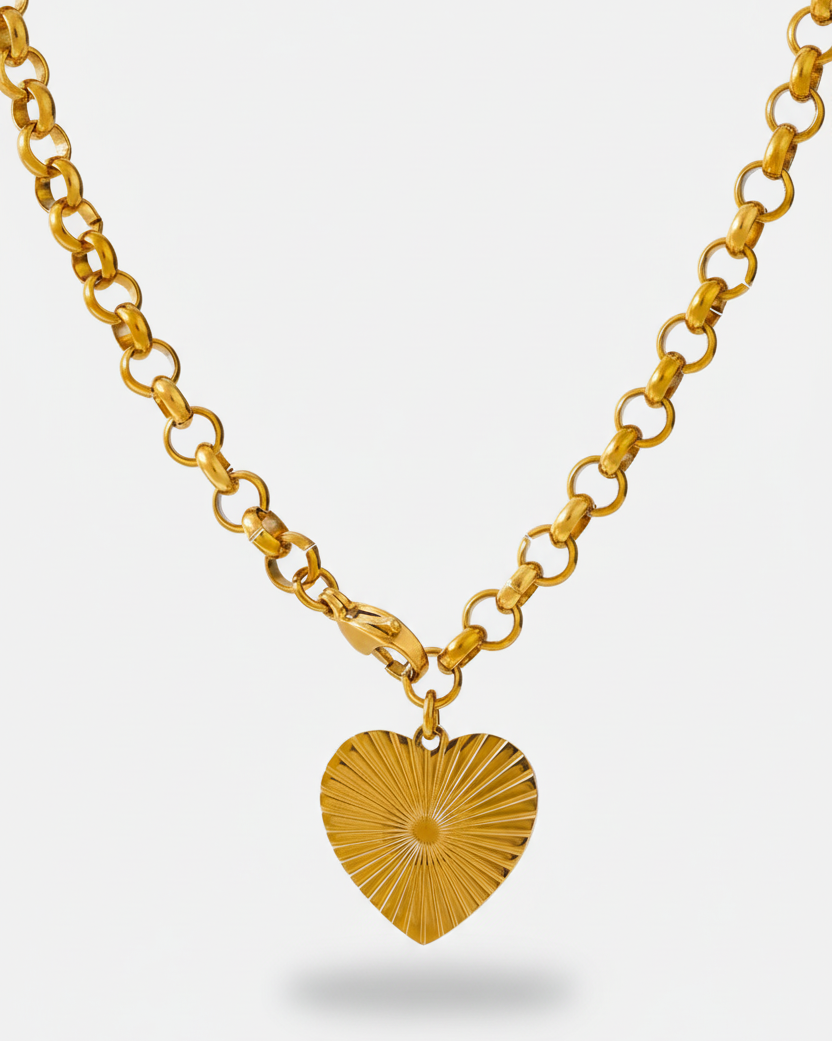 Gold heart-shaped pendant necklace on a white background