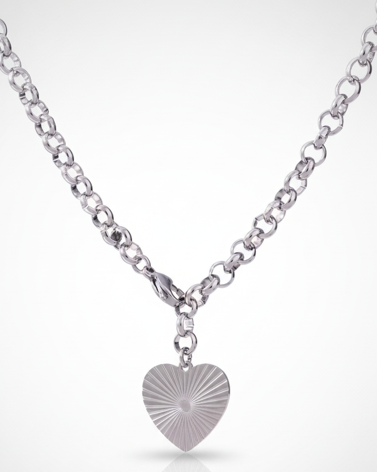 Silver heart-shaped pendant on a chain against a white background