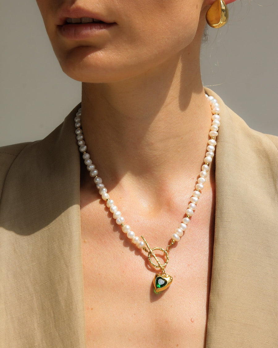 Gold heart freshwater pearl necklace with emerald green stone, elegant jewelry piece by TEGAN RAE JEWELLERY