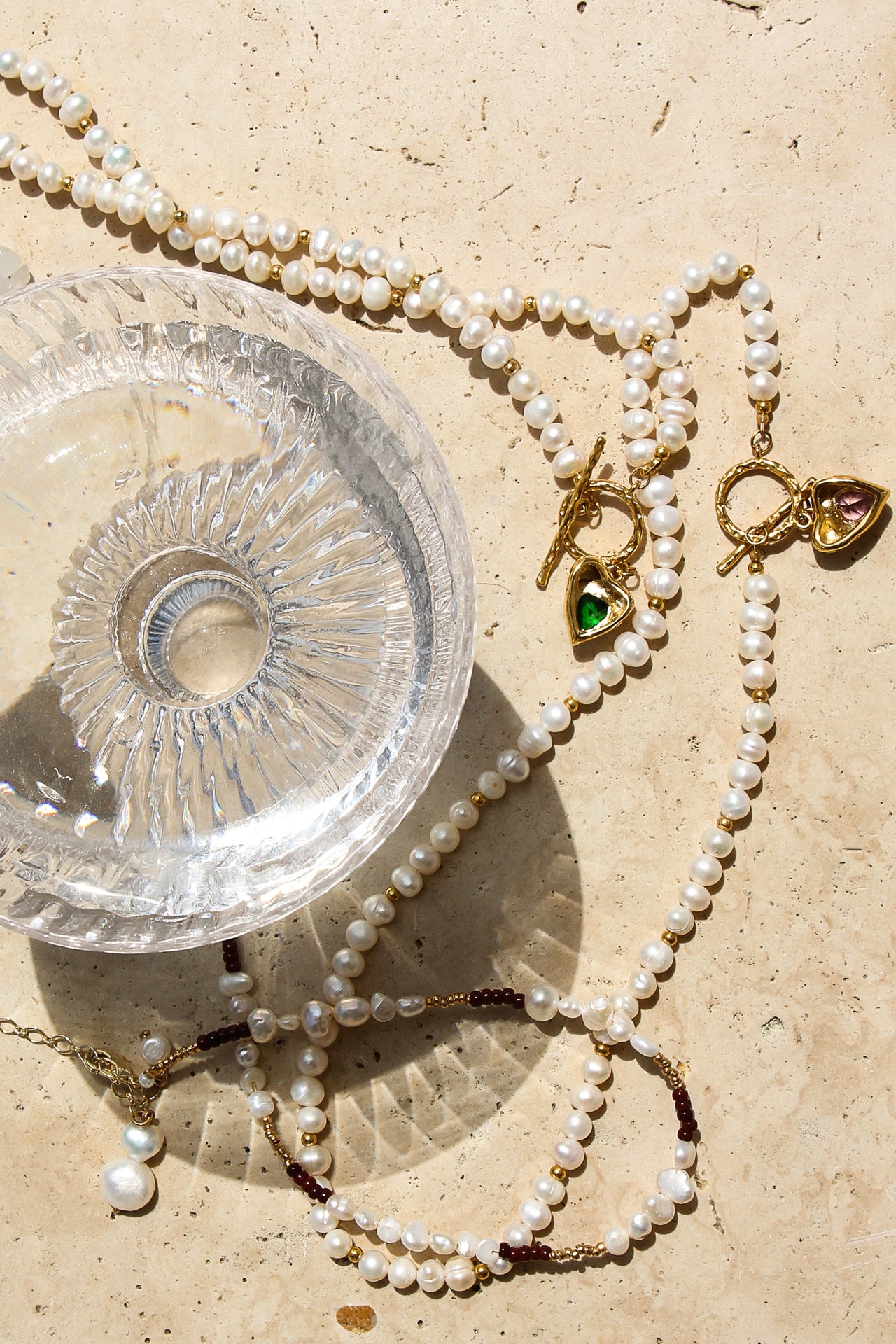 Gold heart freshwater pearl necklace with emerald green stone by TEGAN RAE JEWELLERY, featuring elegant jewelry design.
