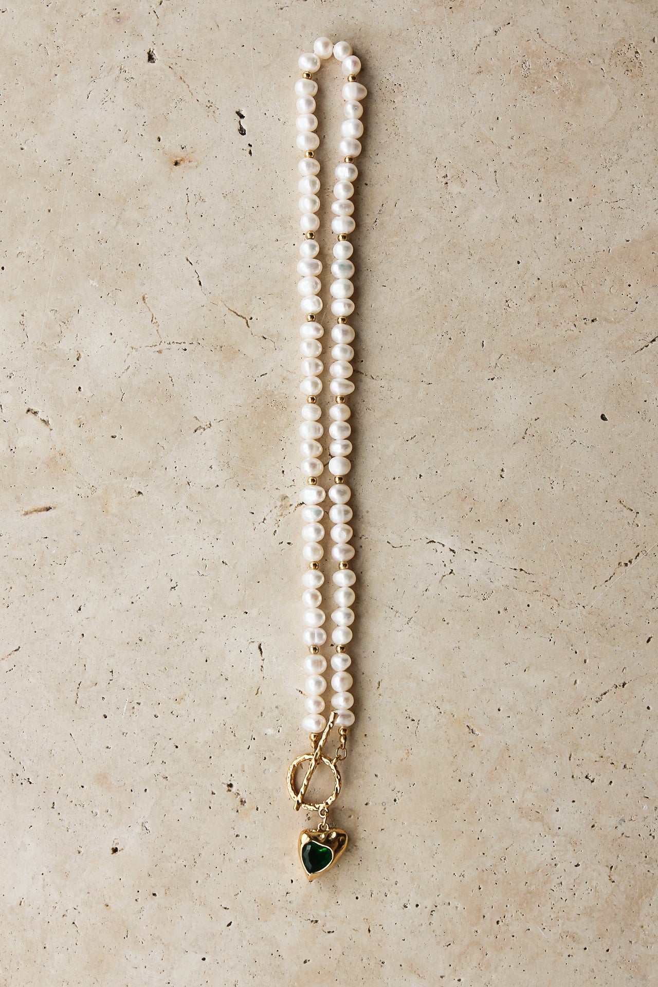 Gold heart freshwater pearl necklace with emerald green stone, elegant jewelry piece by TEGAN RAE JEWELLERY