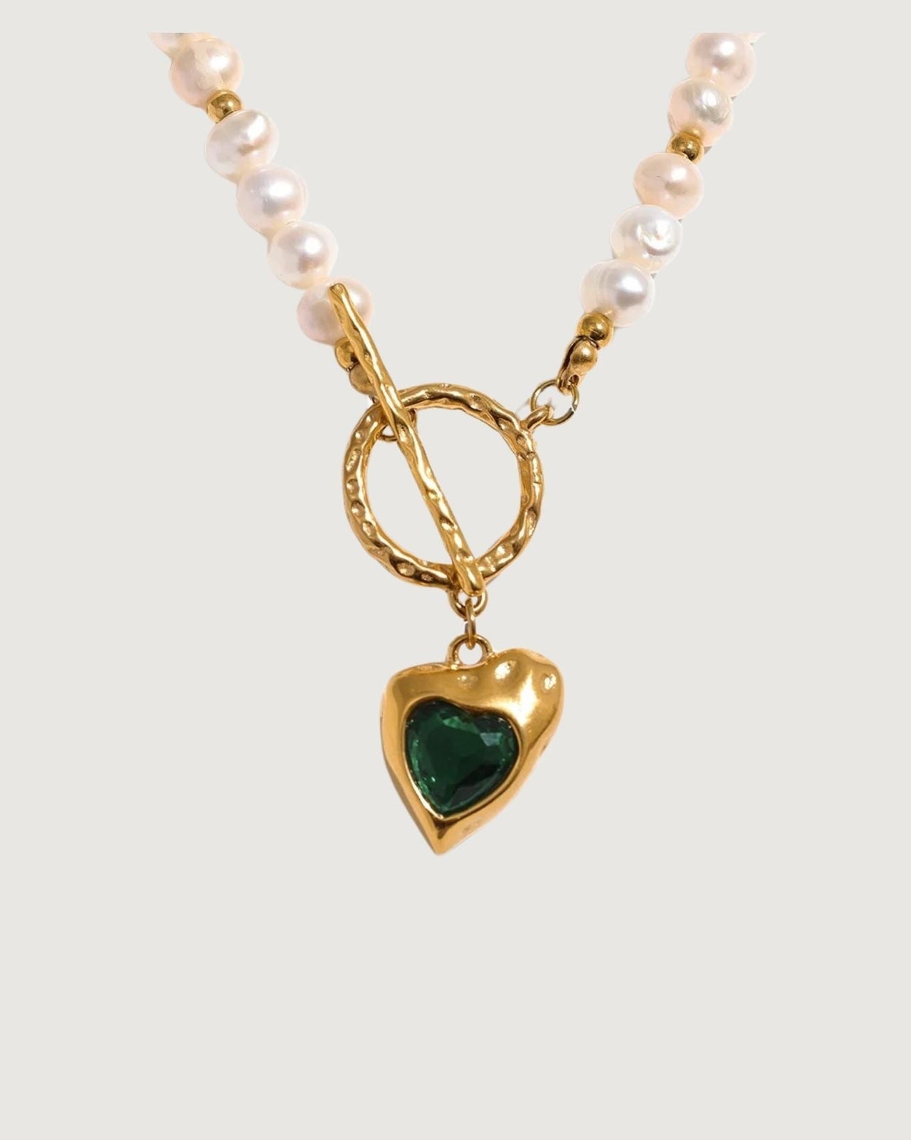 Gold heart freshwater pearl necklace with emerald green stone pendant from Tegan Rae Jewellery, elegant and romantic jewelry.