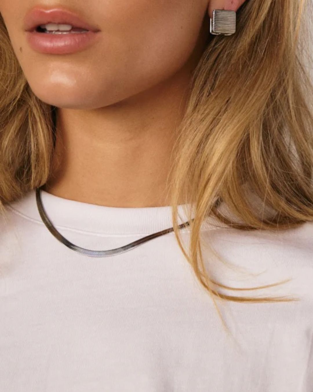 Silver Solace fine snake chain necklace by Tegan Rae Jewellery, close-up of sleek, delicate jewelry with a smooth snake chain design.