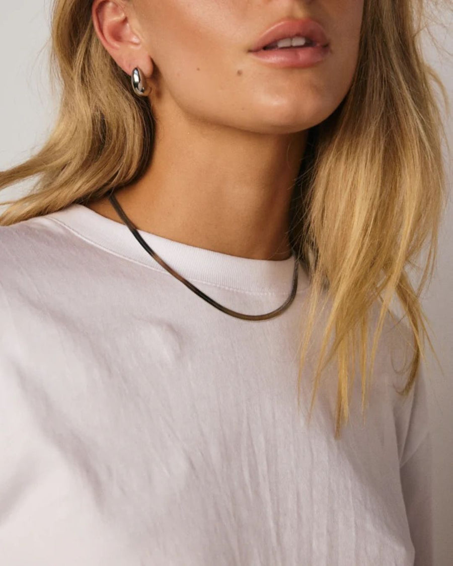 Silver Solace Fine Snake Chain Necklace by Tegan Rae Jewellery, showcasing a sleek, delicate jewelry piece with a smooth, shiny finish.