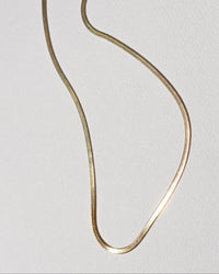 Thumbnail for Tegan Rae Jewellery Solace 18k Gold Fine Snake Chain Necklace showcasing a sleek, elegant gold chain design.