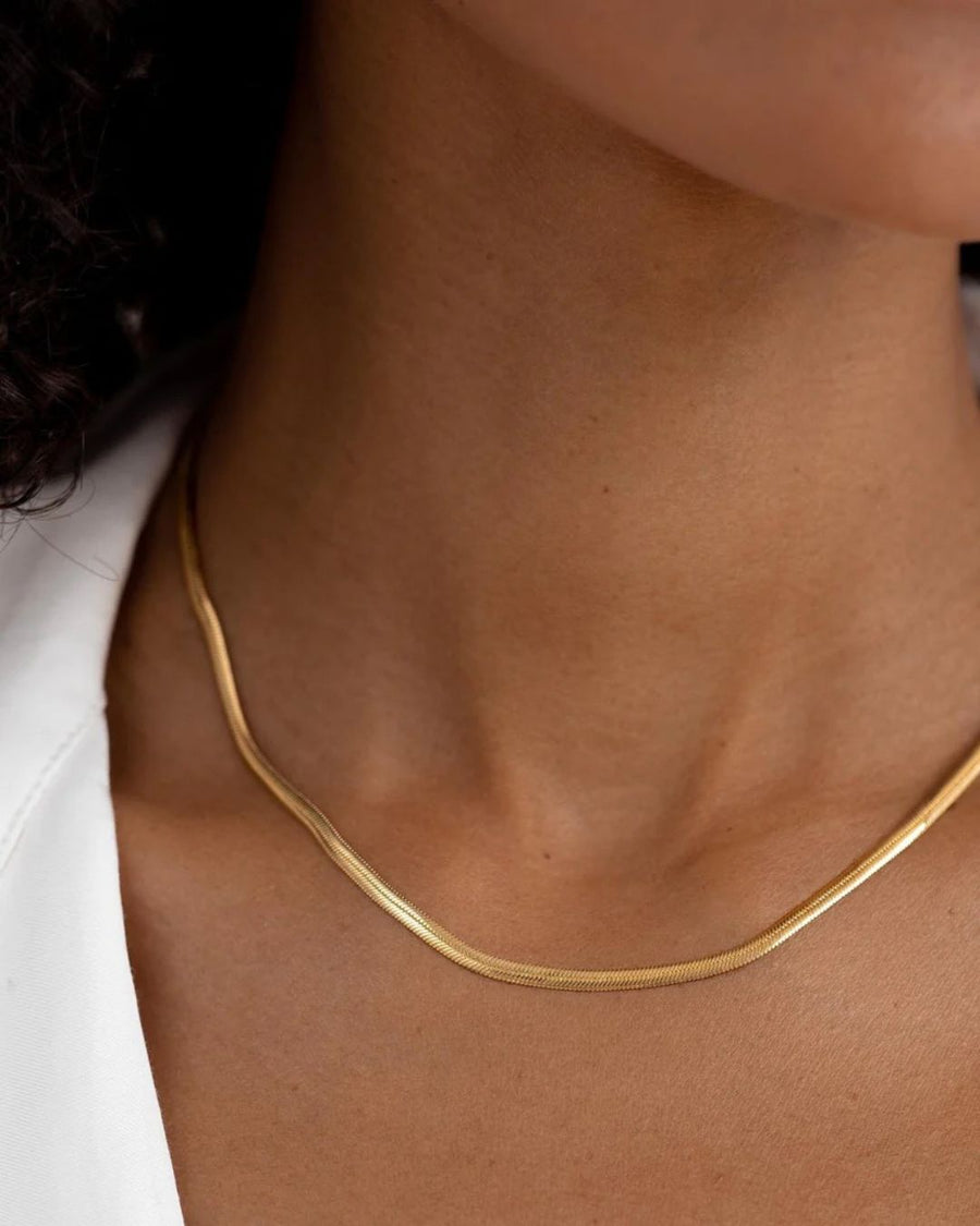 Tegan Rae Jewellery Solace fine snake chain necklace in 18k gold, showcasing a sleek and delicate jewelry piece.