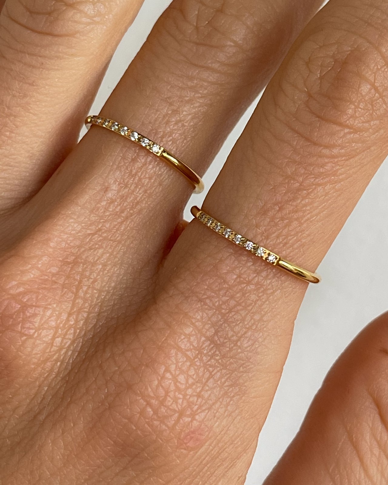 Minimalist stacking zirconia ring by Tegan Rae Jewellery in 18k gold PVD, showcasing smooth band and sparkling stones.