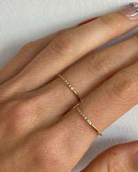 Thumbnail for Minimalist stacking zirconia ring in 18k gold PVD by Tegan Rae Jewellery, showcasing sleek design and sparkling stones.